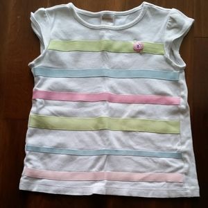 Shirt with green, blue, and pink colorful stripes.
